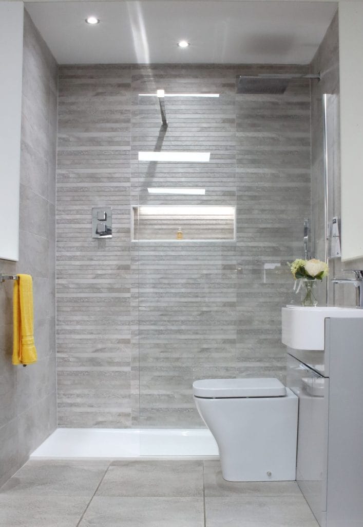 bathroom with grey wc unit and walk in shower y