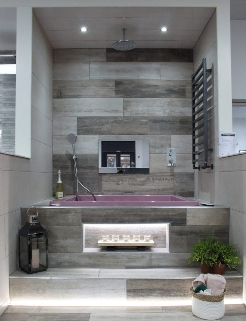 bathroom with white marble effect tiles the bathroom company glasgow