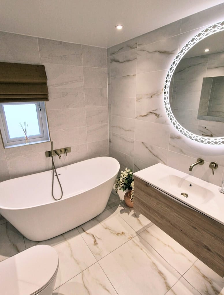 Large freestanding bath with wall mounted bath filler