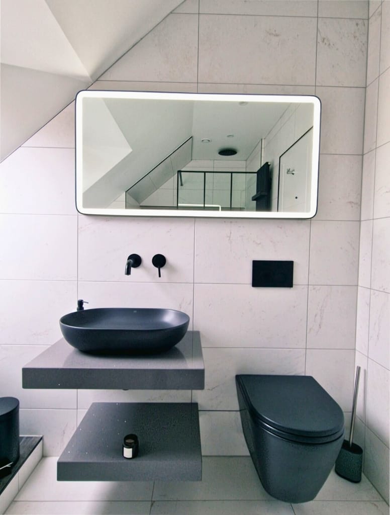 Bathroom with black WC and black sit on bowl with Rocca Granite Worktop