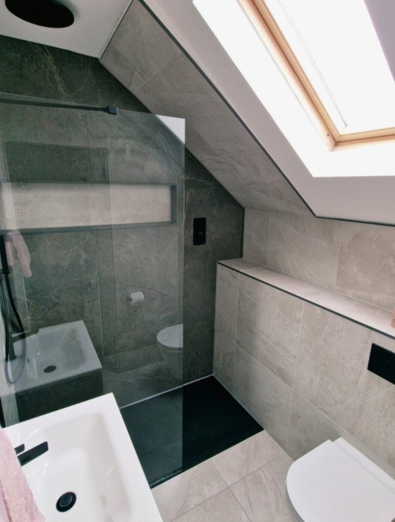 Bathroom with walk in shower and black trims in Milngavie