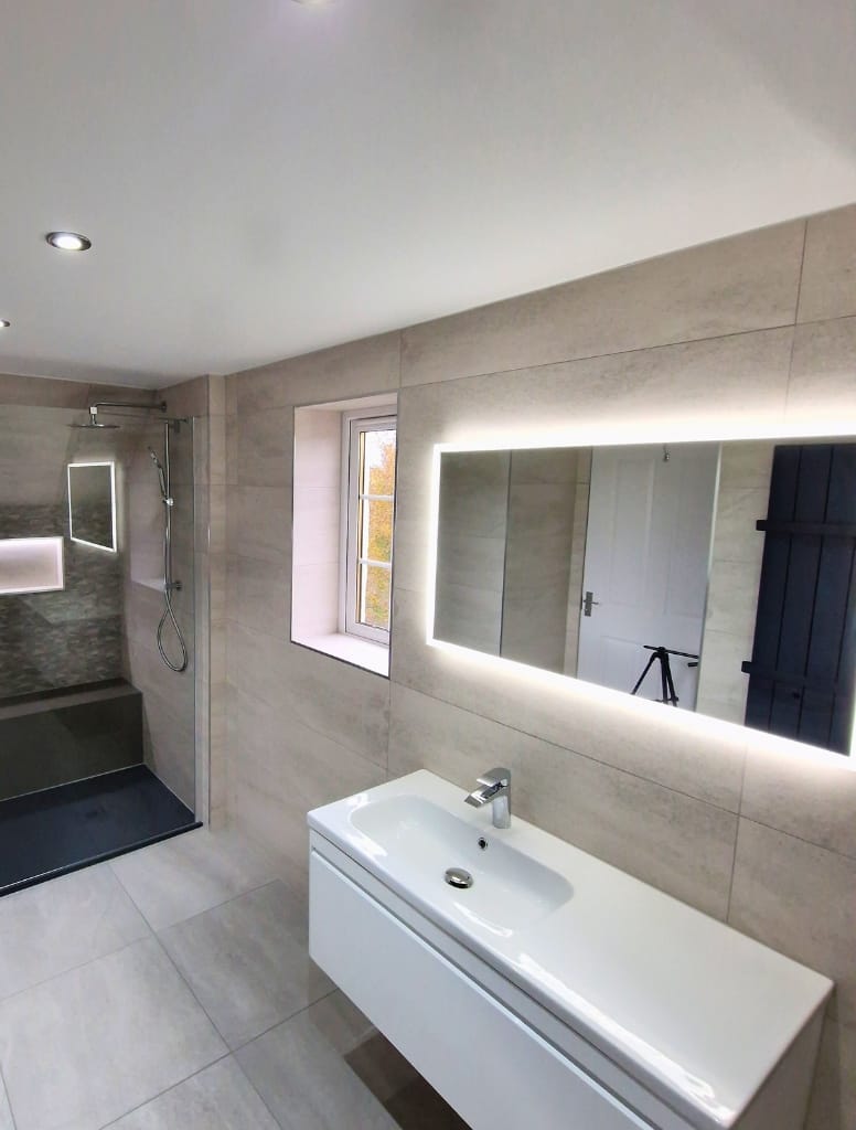 Large led mirror and and white vanity in Killearn